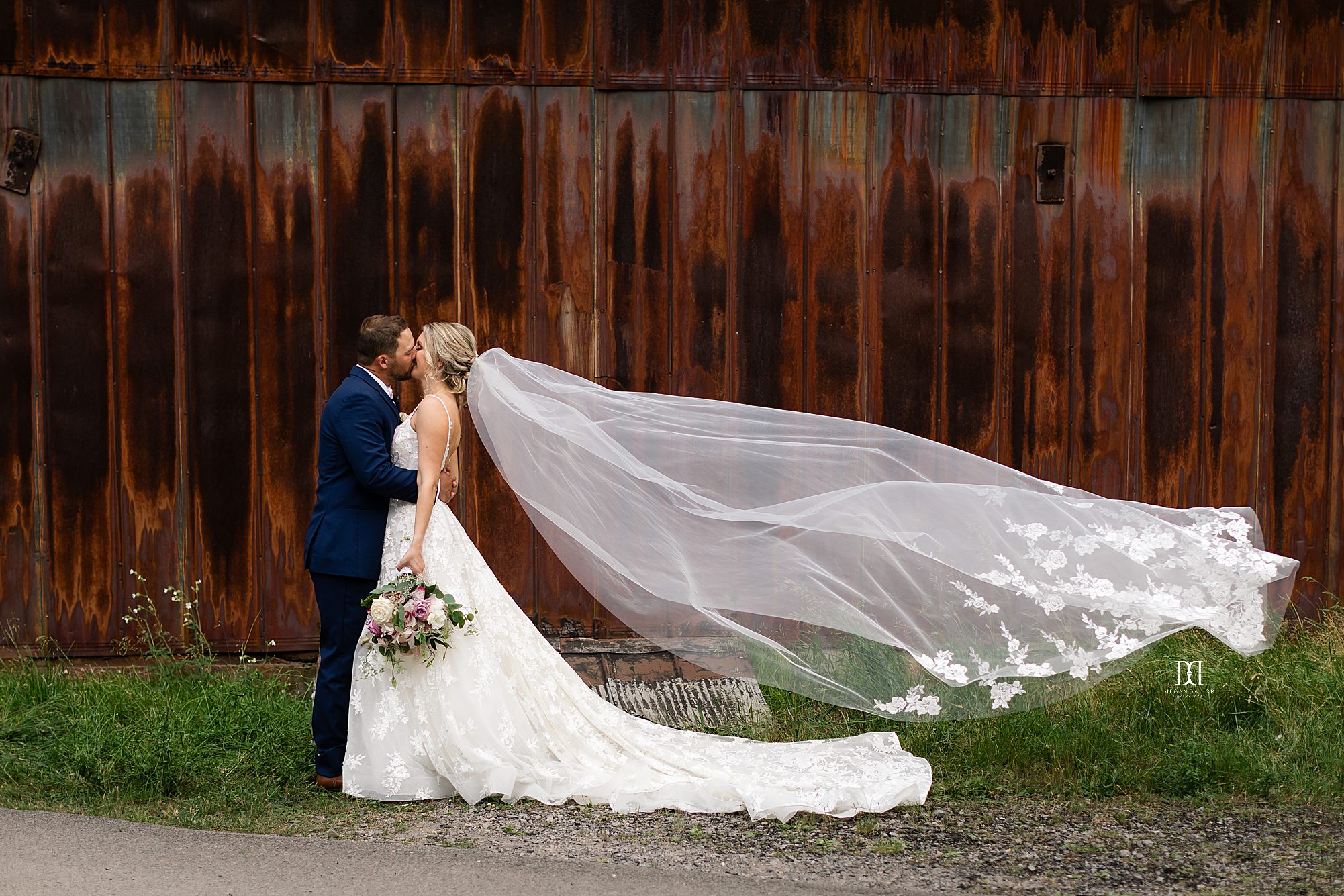 bride and groom kissing irondequoit country club wedding photos