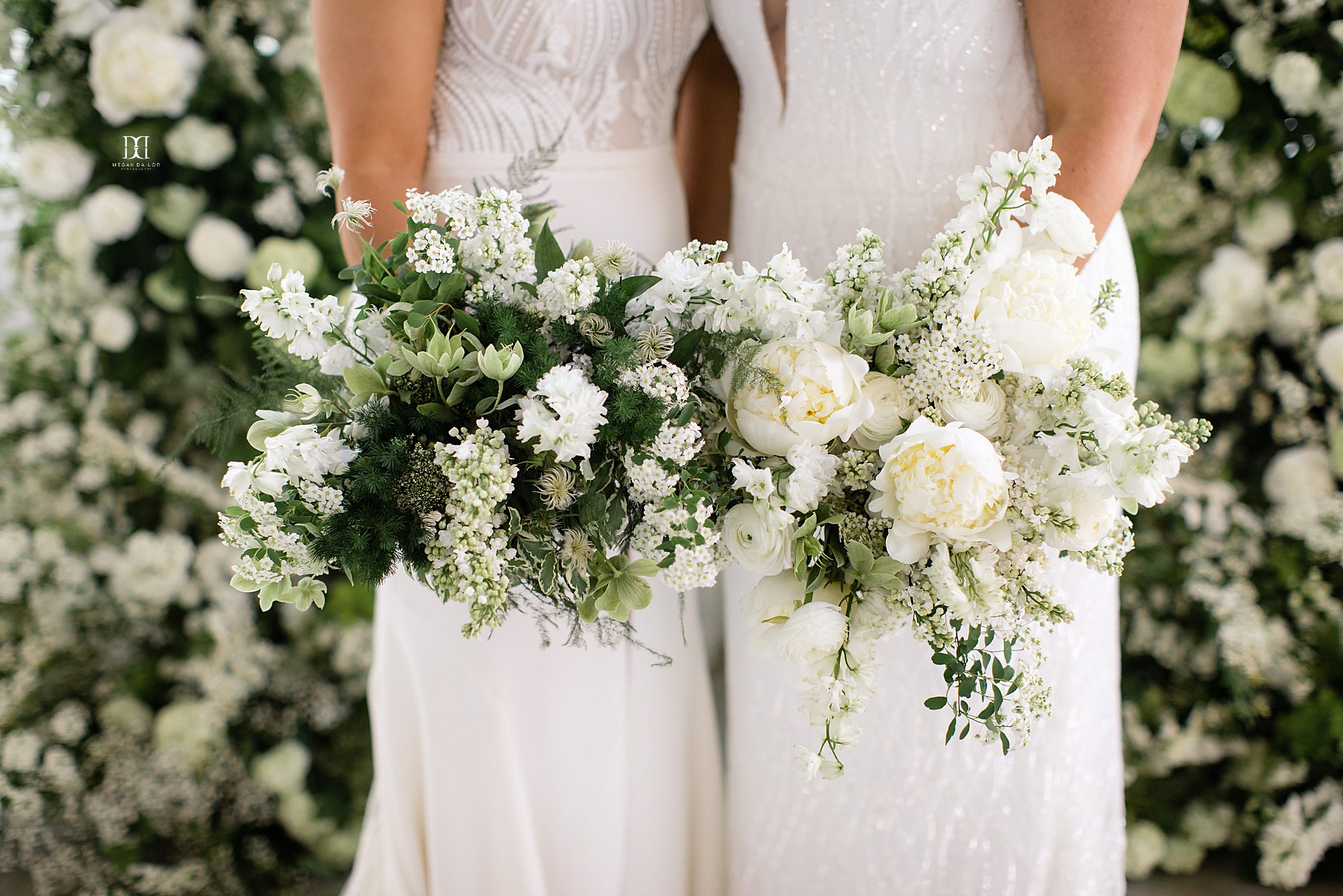 two brides holding bridal bouquets weddings at the highline