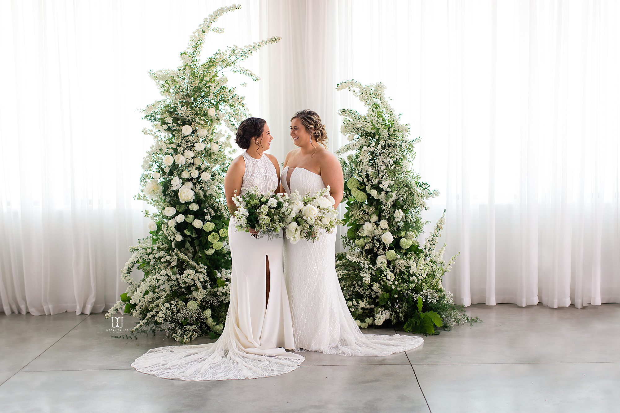 brides posing together at arbor weddings at the highline