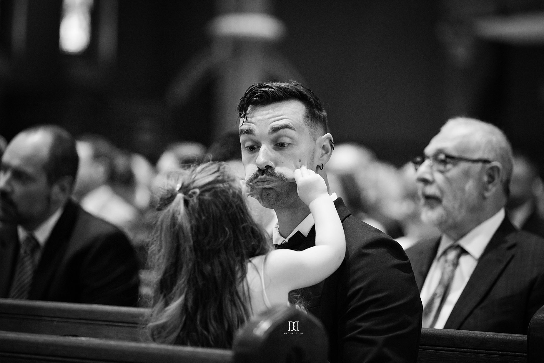 flower girl playing with her dad. Syracuse wedding photographers