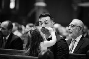 flower girl playing with her dad. Syracuse wedding photographers